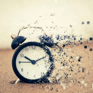 Pixelated effect of clock face over beach background and sandy b